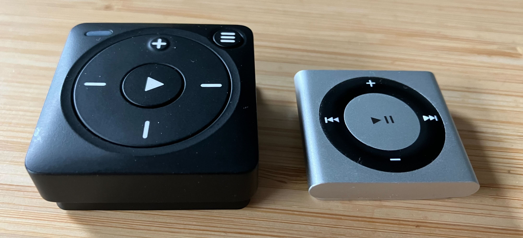 The Mighty 3 next to a fourth gen iPod shuffle, for comparison's sake. It's bigger and deeper by a wide margin.